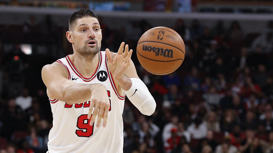 Nov 22, 2025; Chicago, Illinois, USA; Chicago Bulls center Nikola Vucevic (9) passes the ball against the Washington Wizards during the first half at United Center. Mandatory Credit: Kamil Krzaczynski-Imagn Images