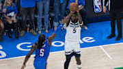 May 22, 2025; Oklahoma City, Oklahoma, USA; Minnesota Timberwolves guard Anthony Edwards (5) shoots against Oklahoma City Thunder guard Luguentz Dort (5) in the fourth quarter during game two of the western conference finals for the 2025 NBA Playoffs at Paycom Center. Mandatory Credit: Brett Rojo-Imagn Images