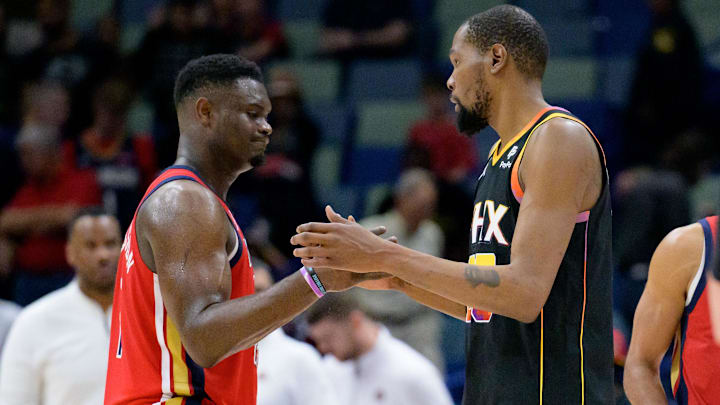 Apr 1, 2024; New Orleans, Louisiana, USA; New Orleans Pelicans forward Zion Williamson, left, congratulates Phoenix Suns forward Kevin Durant, right, after the Suns defeated the Pelicans at Smoothie King Center. Mandatory Credit: Matthew Hinton-Imagn Images