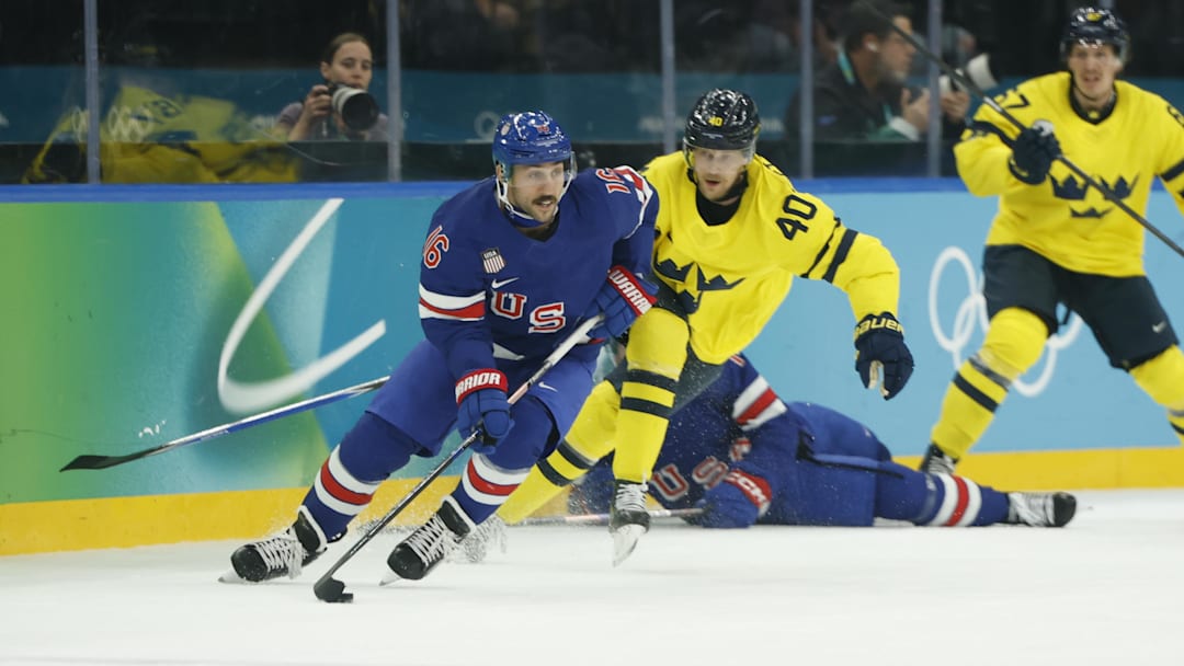 Feb 18, 2026; Milan, Italy; Vincent Trocheck (16) of the United States in action against Elias Pettersson (40) of Sweden in a men's ice hockey quarterfinal during the Milano Cortina 2026 Olympic Winter Games at Milano Santagiulia Ice Hockey Arena. Mandatory Credit: Geoff Burke-Imagn Images