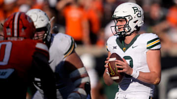 Baylor's Sawyer Robertson (13) looks to pass the ball in the second half of the college football game between the Oklahoma State Cowboys and the Baylor Bears at Boone Pickens Stadium in Stillwater, Okla., Saturday, Sept. 27, 2025.
