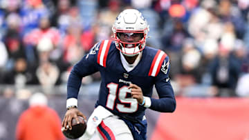 Jan 5, 2025; Foxborough, Massachusetts, USA; New England Patriots quarterback Joe Milton III (19) runs against the Buffalo Bills during the first half at Gillette Stadium. Mandatory Credit: Brian Fluharty-Imagn Images