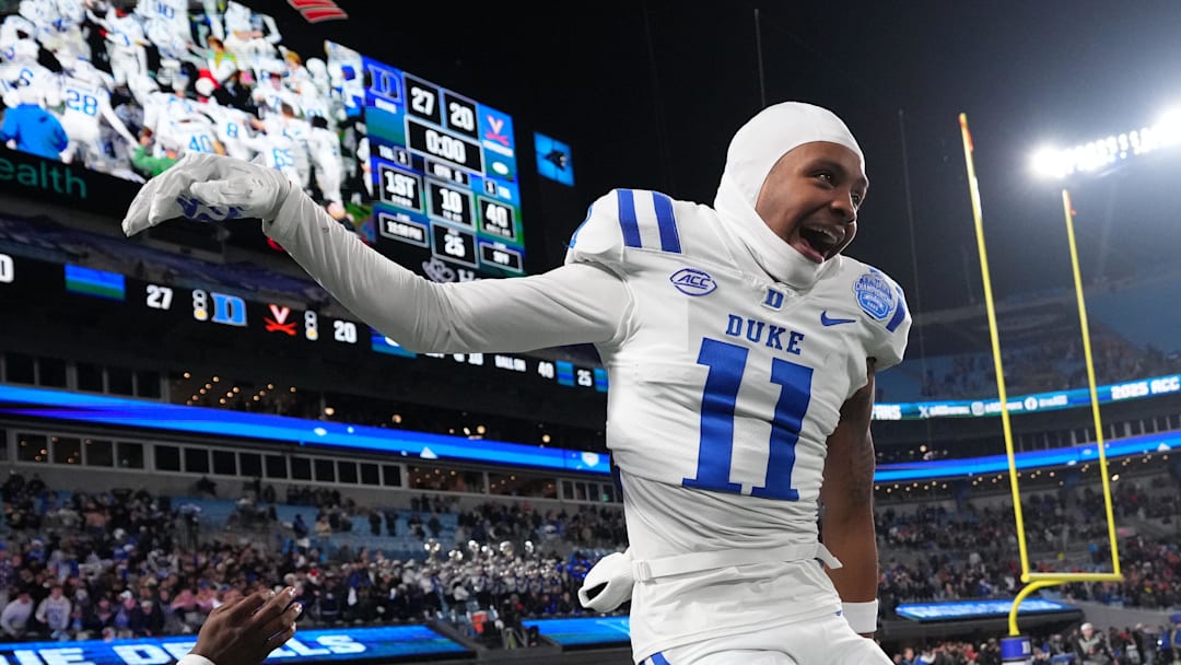 Dec 6, 2025; Charlotte, NC, USA; Duke Blue Devils wide receiver Kavon Simmons (19) and wide receiver Chase Tyler (11) celebrate after winning the  ACC Championship game at Bank of America Stadium.