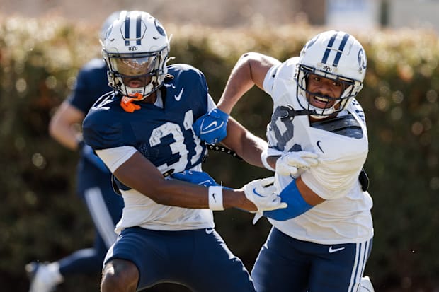 BYU cornerback Kevin Doe and wide receiver Marquis Taliulu at BYU practice