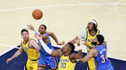 Jun 19, 2025; Indianapolis, Indiana, USA; Oklahoma City Thunder guard Aaron Wiggins (21) goes after a loose ball against Indiana Pacers guard T.J. McConnell (9) and guard Bennedict Mathurin (00) in the fourth quarter during game six of the 2025 NBA Finals at Gainbridge Fieldhouse. Mandatory Credit: Trevor Ruszkowski-Imagn Images