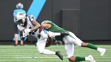 Aug 12, 2023; Charlotte, North Carolina, USA;  New York Jets linebacker Zaire Barnes (53) tackles Carolina Panthers running back Spencer Brown (41).