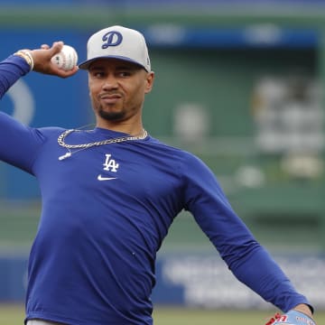 Jun 4, 2024; Pittsburgh, Pennsylvania, USA;  Los Angeles Dodgers shortstop Mookie Betts warms up before the game against the Pittsburgh Pirates at PNC Park. Mandatory Credit: Charles LeClaire-USA TODAY Sports