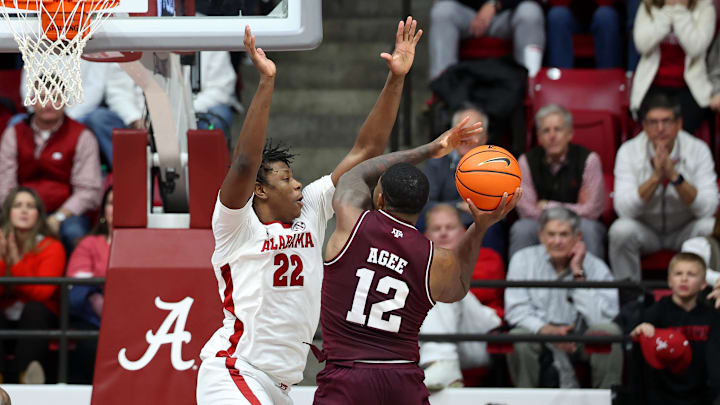 Feb 4, 2026; Tuscaloosa, Alabama, USA; Alabama Crimson Tide forward Aiden Sherrell (22) guards Texas A&M Aggies forward Rashaun Agee (12) during the second half at Coleman Coliseum. Mandatory Credit: David Leong-Imagn Images