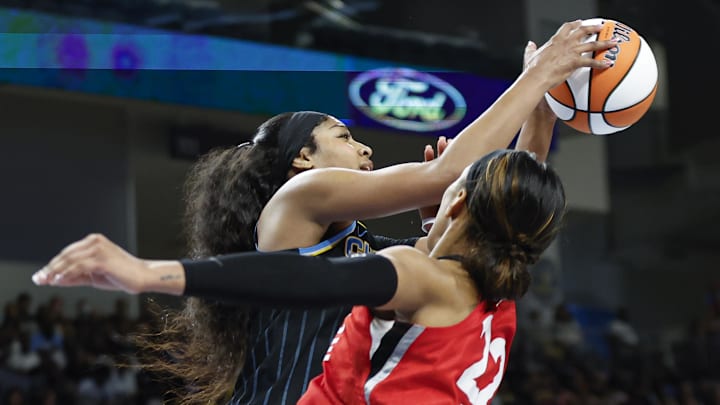 Aug 25, 2024; Chicago, Illinois, USA; Chicago Sky forward Angel Reese (5) blocks Las Vegas Aces center A'ja Wilson (22) during the second half at Wintrust Arena. Mandatory Credit: Kamil Krzaczynski-Imagn Images Aug 25, 2024; Chicago, Illinois, USA; Chicago Sky forward Angel Reese (5) blocks Las Vegas Aces center A'ja Wilson (22) during the second half at Wintrust Arena. Mandatory Credit: Kamil Krzaczynski-Imagn Images