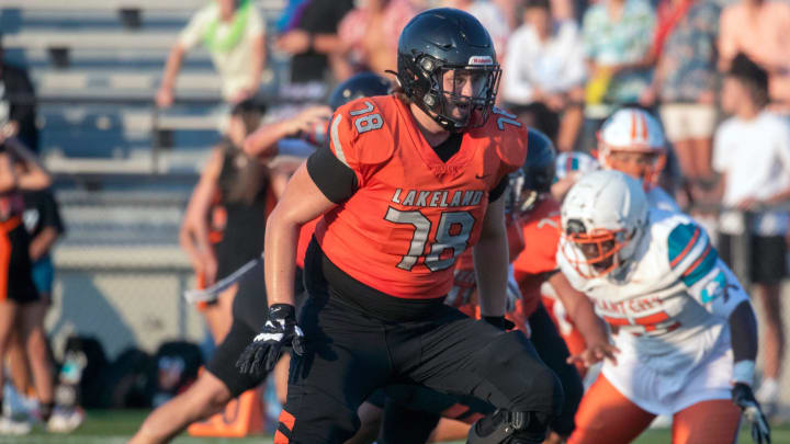 Lakeland's Ben Beymer looks to make a block against Plant City on Friday night at Bryant Stadium.