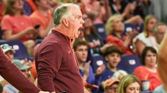 Virginia Tech head coach Mike Young communicates with his team playing Clemson during the first half at Littlejohn Coliseum in Clemson, S.C.