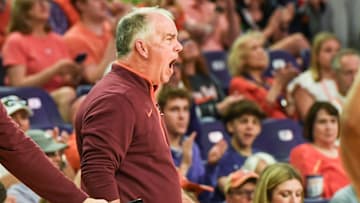 Virginia Tech head coach Mike Young communicates with his team playing Clemson during the first half at Littlejohn Coliseum in Clemson, S.C.