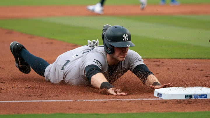 Jun 11, 2025; Kansas City, Missouri, USA; New York Yankees first base Ben Rice (22) dives into third base during the second inning against the Kansas City Royals at Kauffman Stadium. Mandatory Credit: William Purnell-Imagn Images Jun 11, 2025; Kansas City, Missouri, USA; New York Yankees first base Ben Rice (22) dives into third base during the second inning against the Kansas City Royals at Kauffman Stadium. Mandatory Credit: William Purnell-Imagn Images
