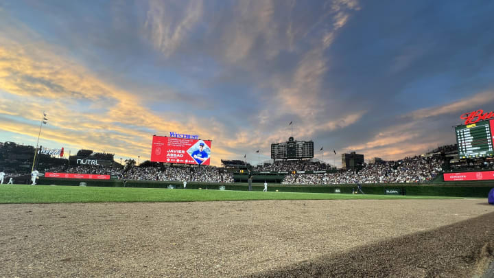 Jun 18, 2024; Chicago, Illinois, USA; The sun sets at Wrigley Field during the sixth inning.