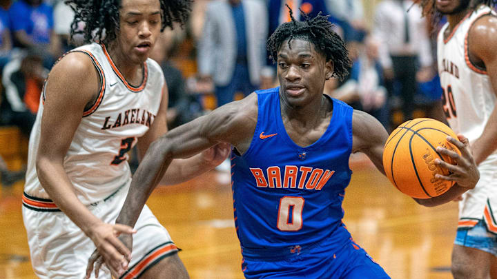 Bartow's Antwan Willis drives to the basket against Lakeland on Saturday night in the championship game of the Class 6A, Distrct 7 boys basketball tournament.