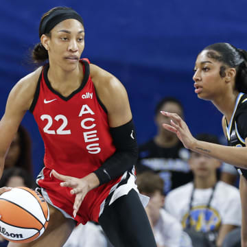 Las Vegas Aces center A'ja Wilson (22) is defended by Chicago Sky forward Angel Reese (5) 