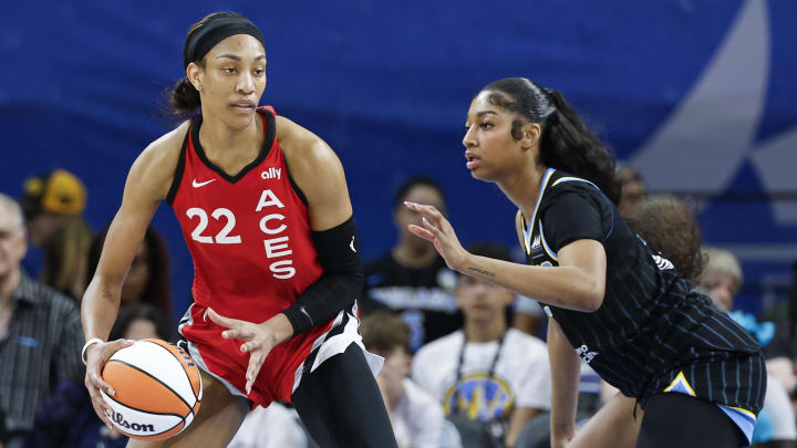 Las Vegas Aces center A'ja Wilson (22) is defended by Chicago Sky forward Angel Reese (5) 