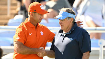Oct 4, 2025; Chapel Hill, North Carolina, USA; Clemson Tigers head coach Dabo Swinney with North Carolina Tar Heels head coach Bill Belichick before the game at Kenan Stadium. Mandatory Credit: Bob Donnan-Imagn Images