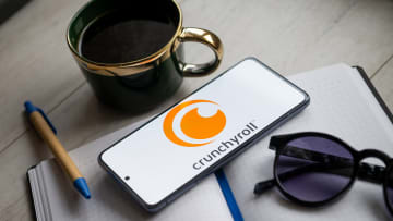 In this photo illustration a Crunchyroll logo seen displayed...