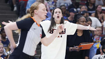 Jul 27, 2025; Chicago, Illinois, USA; Injured Indiana Fever guard Caitlin Clark (22) reacts to a call against her team during the first half of a basketball game against the Chicago Sky at United Center. Mandatory Credit: Kamil Krzaczynski-Imagn Images