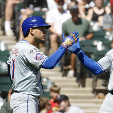 New York Mets shortstop Francisco Lindor (12) celebrates with second baseman Jose Iglesias (11) after hitting a solo home run against the Chicago White Sox during the fourth inning at Guaranteed Rate Field on Sept 1.