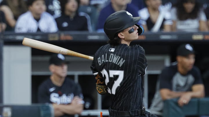 Chicago White Sox second baseman Brooks Baldwin (27) hits an RBI-single against the Chicago Cubs during the second inning at Guaranteed Rate Field on Aug 10.