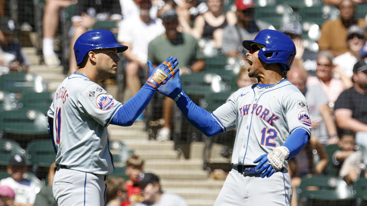 New York Mets shortstop Francisco Lindor (12) celebrates with second baseman Jose Iglesias (11) after hitting a solo home run against the Chicago White Sox during the fourth inning at Guaranteed Rate Field on Sept 1.