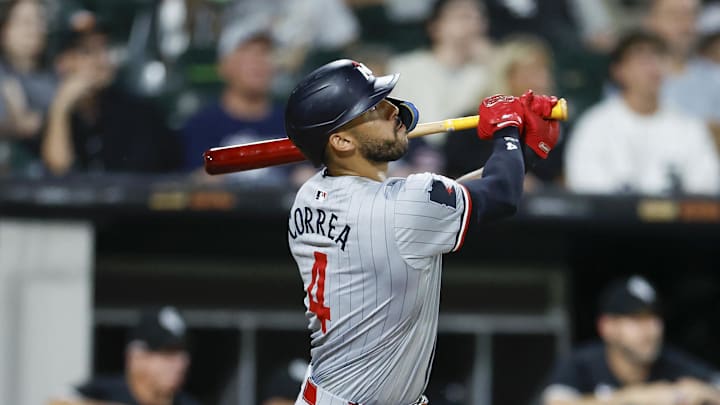 Minnesota Twins shortstop Carlos Correa (4) hits a solo home run against the Chicago White Sox during the seventh inning at Guaranteed Rate Field in Chicago on July 8, 2024.