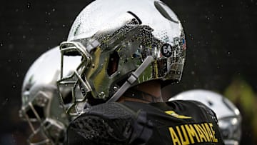 Autzen Stadium reflects through the raindrops on Oregon defensive tackle Popo Aumavae.