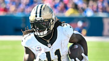 Sep 28, 2025; Orchard Park, New York, USA; New Orleans Saints running back Alvin Kamara (41) carries the ball against the Buffalo Bills in the third quarter at Highmark Stadium. Mandatory Credit: Mark Konezny-Imagn Images