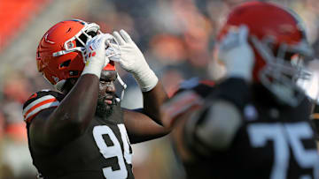Cleveland Browns defensive tackle Dalvin Tomlinson (94) heads off the field after warming up before an NFL football game at Huntington Bank Field, Sunday, Oct. 27, 2024, in Cleveland, Ohio.