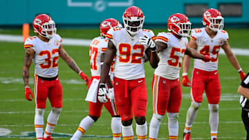 Dec 13, 2020; Miami Gardens, Florida, USA; Kansas City Chiefs defensive end Tanoh Kpassagnon (92) walks up to the line of scrimmages with teammates during the first half against the Miami Dolphins at Hard Rock Stadium. Mandatory Credit: Jasen Vinlove-Imagn Images