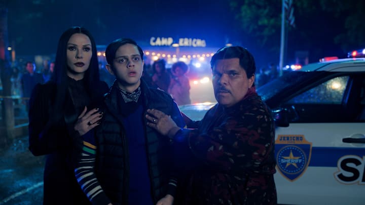 (L to R) Catherine Zeta-Jones as Morticia Addams, Isaac Ordonez as Pugsley Addams, and Luis Guzmán as Gomez Addams in episode 203 of Wednesday