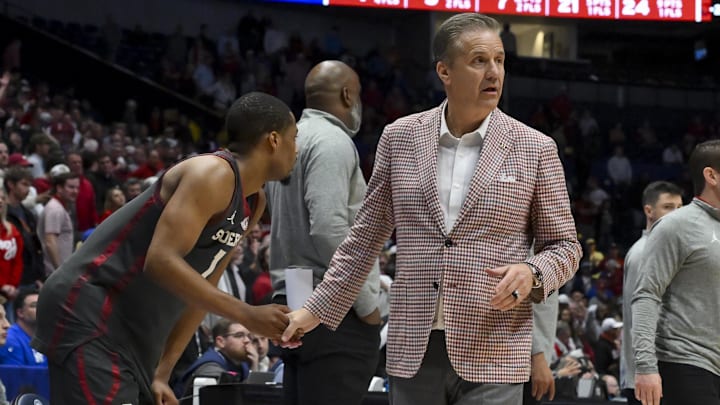 Mar 13, 2026; Nashville, TN, USA;  Arkansas Razorbacks head coach John Calipari shakes the hand of Oklahoma Sooners guard Xzayvier Brown (1) during the second half at Bridgestone Arena. Mandatory Credit: Steve Roberts-Imagn Imagesduring the first half 
