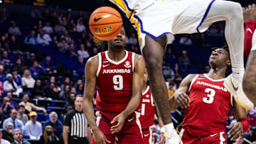 Jan 14, 2025; Baton Rouge, Louisiana, USA;  LSU Tigers forward Corey Chest (11) dunks the ball against Arkansas Razorbacks forward Jonas Aidoo (9) during the first half at Pete Maravich Assembly Center. Mandatory Credit: Stephen Lew-Imagn Images