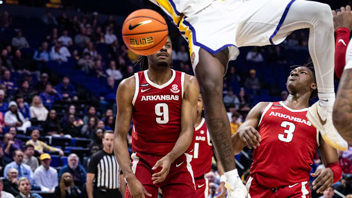 Jan 14, 2025; Baton Rouge, Louisiana, USA;  LSU Tigers forward Corey Chest (11) dunks the ball against Arkansas Razorbacks forward Jonas Aidoo (9) during the first half at Pete Maravich Assembly Center. Mandatory Credit: Stephen Lew-Imagn Images