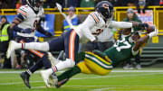 Bears cornerback Tyrique Stevenson (29) breaks up a potential touchdown reception against Packers WR Romeo Doubs.