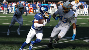 Sep 28, 2025; East Rutherford, New Jersey, USA; New York Giants wide receiver Wan'Dale Robinson (17) gains yards after catch as Los Angeles Chargers linebacker Troy Dye (43) pursues during the second half at MetLife Stadium. Mandatory Credit: Vincent Carchietta-Imagn Images