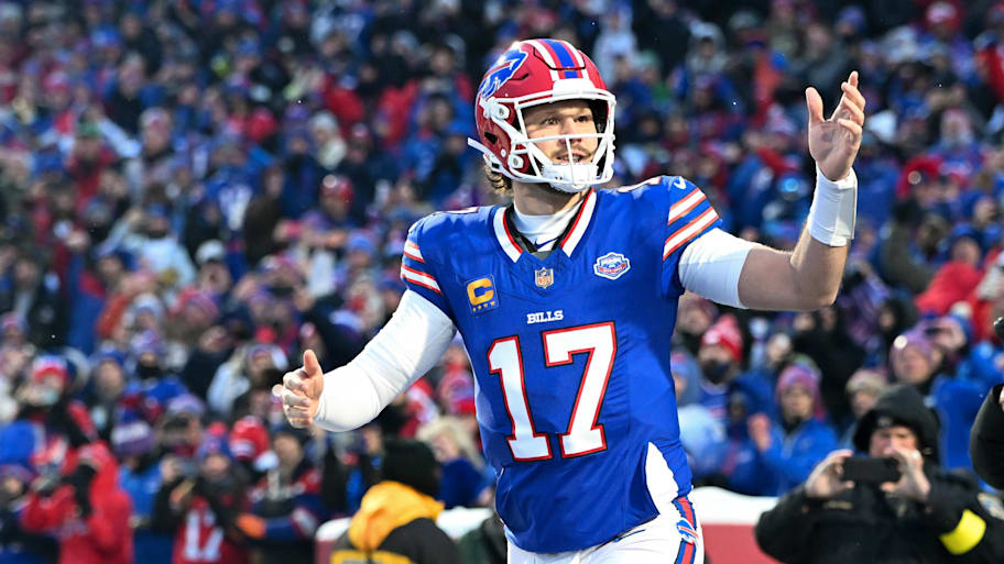 Buffalo Bills quarterback Josh Allen runs onto the field before the game against the New York Jets.