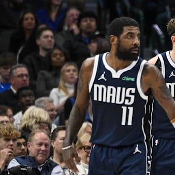 Jan 3, 2024; Dallas, Texas, USA; Dallas Mavericks guard Kyrie Irving (11) and guard Luka Doncic (77) face the Portland Trail Blazers attack during the second half at the American Airlines Center. Mandatory Credit: Jerome Miron-Imagn Images