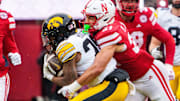 Nebraska defensive back Donovan Jones tackles Iowa's Kamari Moulton during the teams' regular-season finale. The Huskers' defense will face a challenge in Utah's high-powered running game in the Las Vegas Bowl.