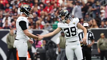 Nov 9, 2025; Houston, Texas, USA; Jacksonville Jaguars place kicker Cam Little (39) reacts with holder Logan Cooke (9) after a made field goal against the Houston Texans during the first half at NRG Stadium. Mandatory Credit: Thomas Shea-Imagn Images