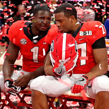 Jan 8, 2018; Atlanta, GA, USA; Georgia Bulldogs running back Sony Michel (1) and Georgia Bulldogs running back Nick Chubb (27) react after loosing to the Alabama Crimson Tide in the 2018 CFP national championship college football game at Mercedes-Benz Stadium. Mandatory Credit: Jason Getz-Imagn Images