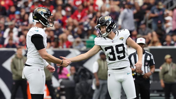 Nov 9, 2025; Houston, Texas, USA; Jacksonville Jaguars place kicker Cam Little (39) reacts with holder Logan Cooke (9) after a made field goal against the Houston Texans during the first half at NRG Stadium. Mandatory Credit: Thomas Shea-Imagn Images