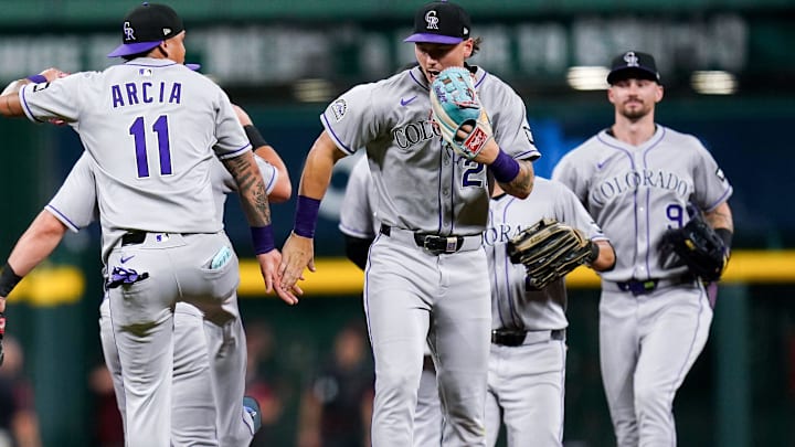 The Colorado Rockies celebrate after a 3-2 win against the Cincinnati Reds, Friday, July 11, 2025, at Great American Ball Park in Downtown Cincinnati.