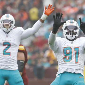 Dec 3, 2023; Landover, Maryland, USA; Miami Dolphins defensive end Emmanuel Ogbah (91) celebrates after recording a sack against the Washington Commanders during the second quarter at FedExField. Mandatory Credit: Geoff Burke-USA TODAY Sports