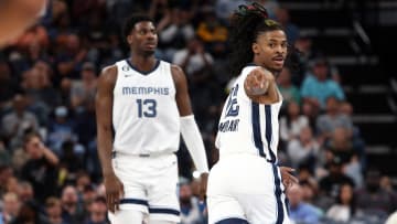 Apr 4, 2023; Memphis, Tennessee, USA; Memphis Grizzlies guard Ja Morant (12) points toward Memphis Grizzlies guard Desmond Bane (not pictured) after an assist during the second half against the Portland Trail Blazers at FedExForum. Mandatory Credit: Petre Thomas-USA TODAY Sports