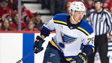 Dec 5, 2024; Calgary, Alberta, CAN; St. Louis Blues center Zachary Bolduc (76) skates against the Calgary Flames during the first period at Scotiabank Saddledome. Mandatory Credit: Brett Holmes-Imagn Images