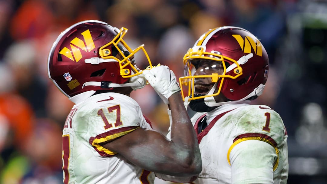 Nov 30, 2025; Landover, Maryland, USA; Washington Commanders wide receiver Terry McLaurin (17) celebrates after scoring a touchdown with Washington Commanders wide receiver Deebo Samuel (1) in overtime of the game at Northwest Stadium. Mandatory Credit: Peter Casey-Imagn Images