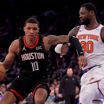 Jan 17, 2024; New York, New York, USA; Houston Rockets forward Jabari Smith Jr. (10) controls the ball against New York Knicks forward Julius Randle (30) during the fourth quarter at Madison Square Garden. Mandatory Credit: Brad Penner-Imagn Images